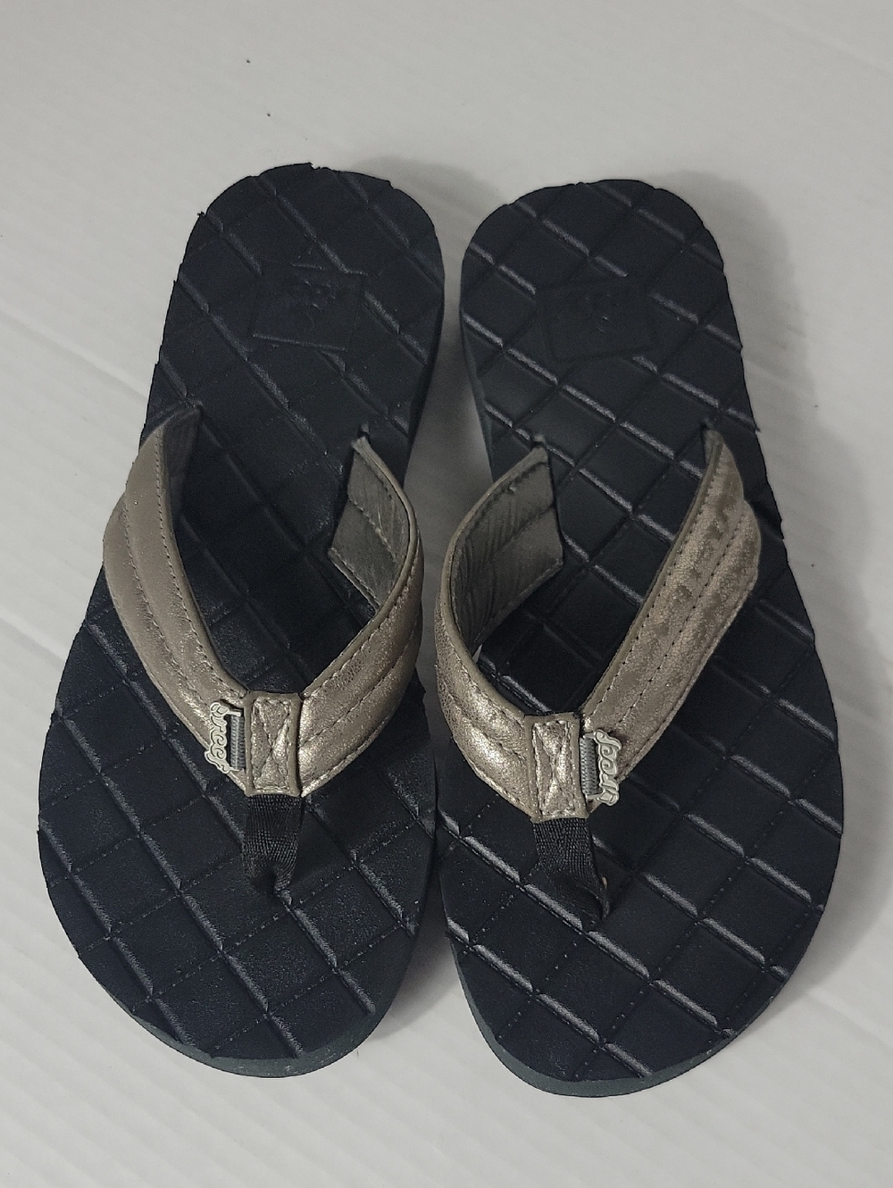 Reef Black Footbed with Metallic Bronze Straps Flip Flops